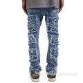 Pantalones de jeans lavados desgastados con rasgadura personalizada